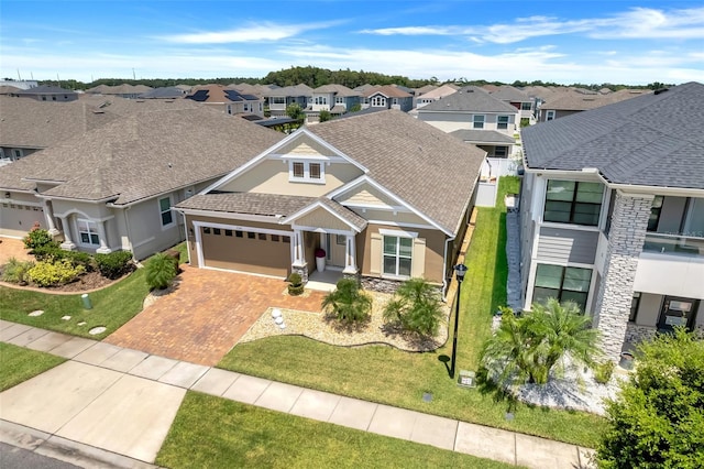 view of front facade with a garage and a front lawn