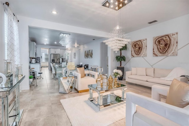 tiled living room featuring a notable chandelier