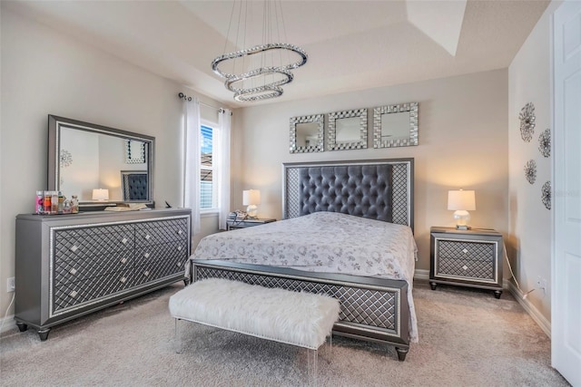 carpeted bedroom with a chandelier