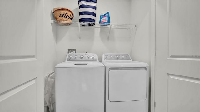 laundry area with laundry area and washer and dryer