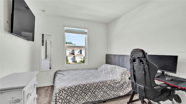 bedroom with carpet and baseboards