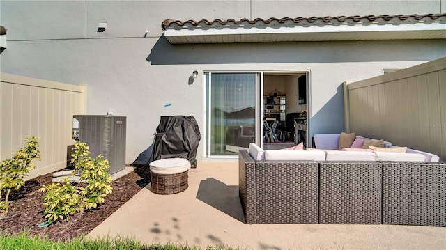 view of patio / terrace featuring central AC unit, a fenced backyard, and an outdoor living space