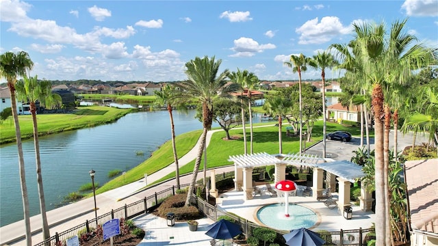 property view of water with fence and a residential view