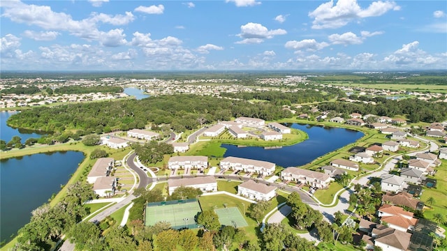 drone / aerial view with a residential view and a water view