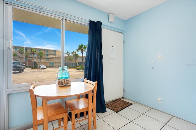 dining area featuring light tile patterned flooring