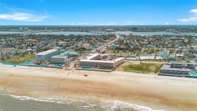 birds eye view of property with a view of city, a water view, and a view of the beach