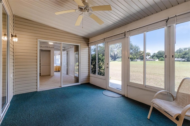 unfurnished sunroom with ceiling fan and lofted ceiling