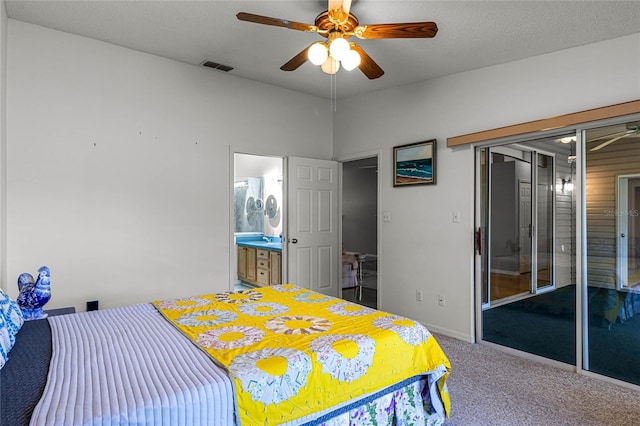 carpeted bedroom featuring ceiling fan and ensuite bathroom