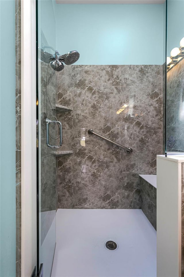 bathroom with tiled shower