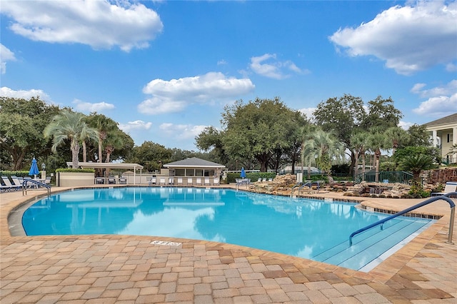 view of swimming pool featuring a patio area