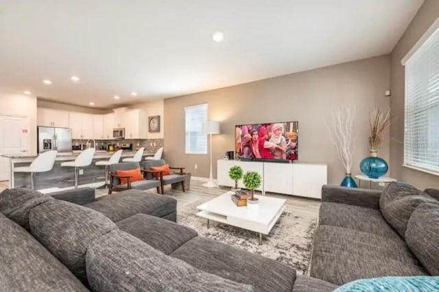 living room with light hardwood / wood-style flooring