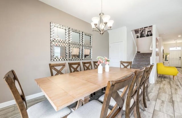 dining area featuring a chandelier and light hardwood / wood-style flooring