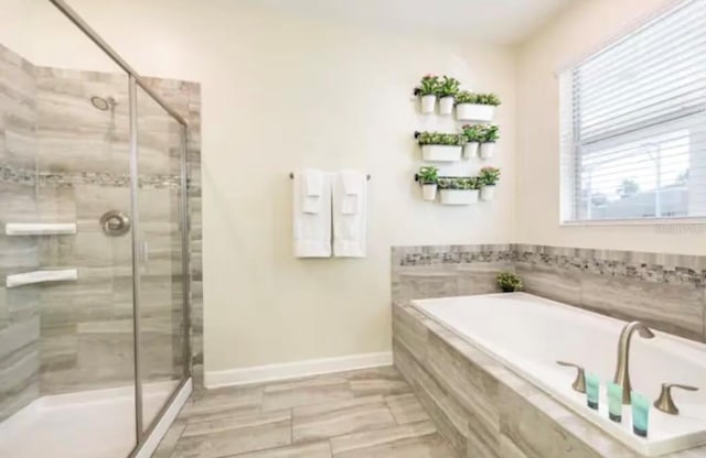 bathroom featuring independent shower and bath and tile patterned floors