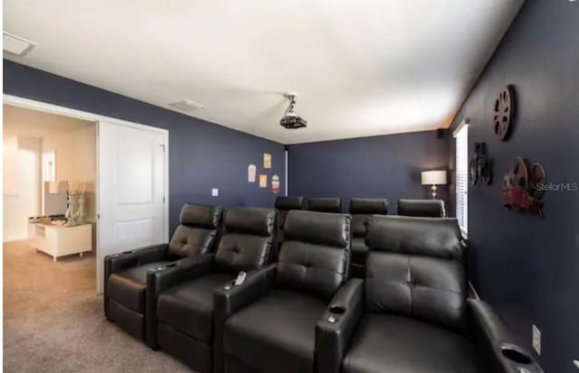 home theater room featuring carpet flooring