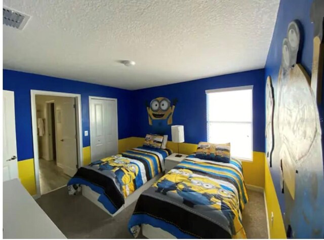 bedroom with a closet and a textured ceiling