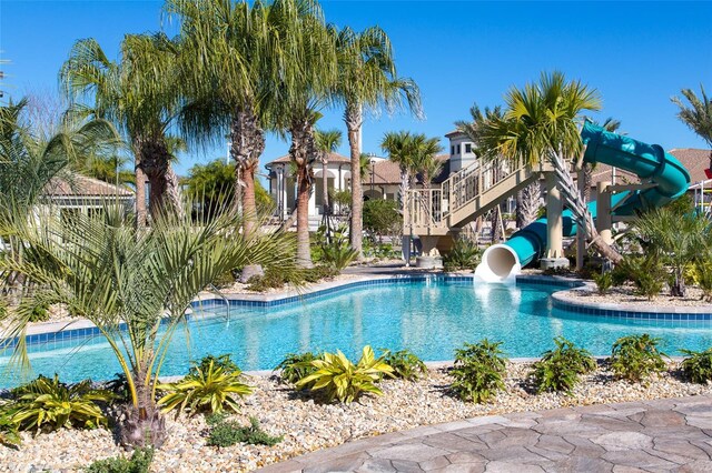 view of pool with a water slide