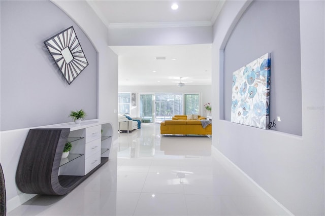 hallway featuring visible vents, baseboards, recessed lighting, ornamental molding, and tile patterned flooring