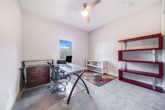 carpeted home office with ceiling fan