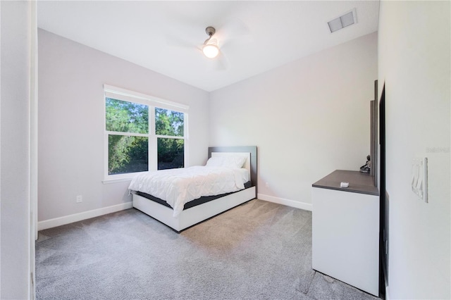 unfurnished bedroom featuring ceiling fan and light carpet