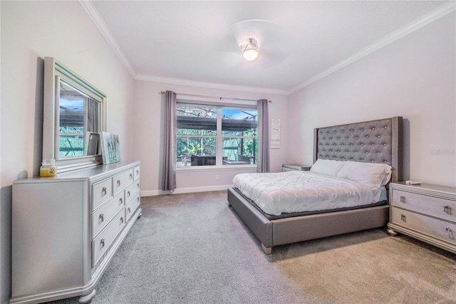 carpeted bedroom with crown molding and ceiling fan