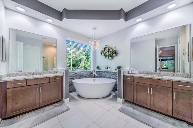 bathroom with vanity, separate shower and tub, and tile patterned flooring