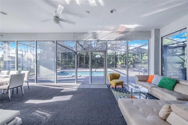 interior space with ceiling fan