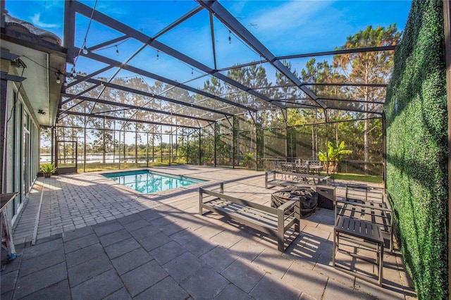 view of pool featuring a lanai and a patio