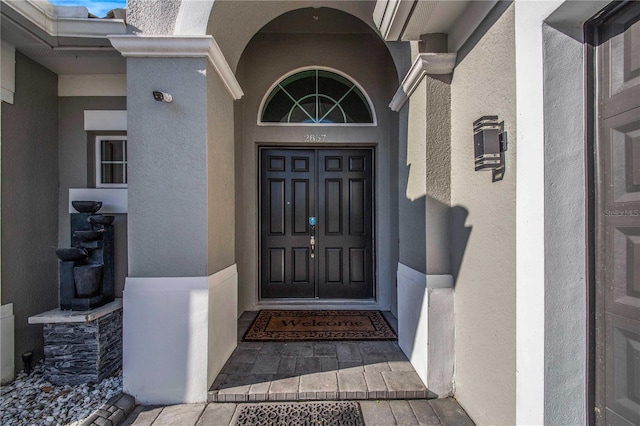 doorway to property featuring a porch