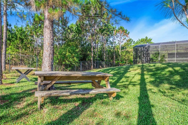 view of property's community featuring a yard