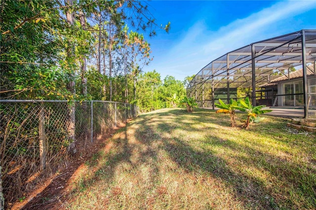 view of yard featuring glass enclosure