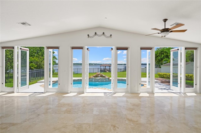 unfurnished living room featuring lofted ceiling and ceiling fan