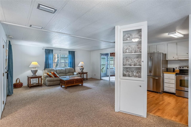 236 Peppertree Ct, Lake Mary, FL 32746 - living room featuring light colored carpet and a textured ceiling