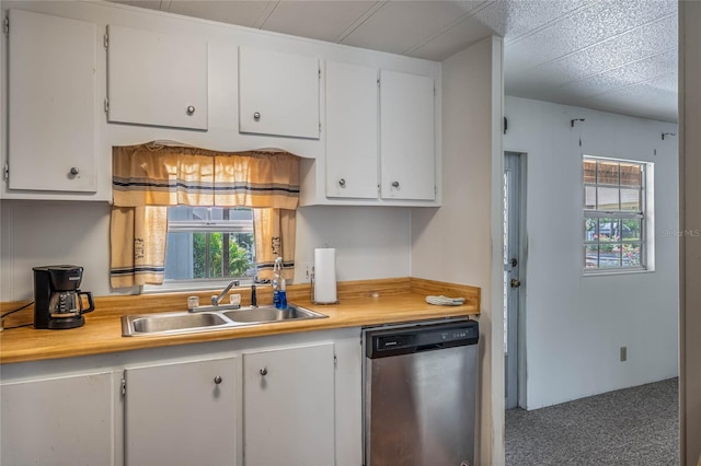236 Peppertree Ct, Lake Mary, FL 32746 - kitchen featuring stainless steel dishwasher, a sink, light countertops, and white cabinetry