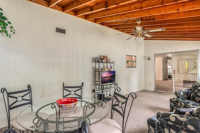 236 Peppertree Ct, Lake Mary, FL 32746 - carpeted dining room featuring a ceiling fan and wooden walls