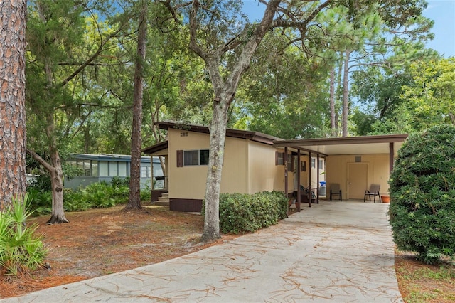 236 Peppertree Ct, Lake Mary, FL 32746 - view of front facade featuring concrete driveway and a carport