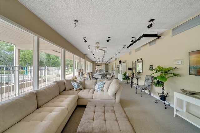 236 Peppertree Ct, Lake Mary, FL 32746 - living area featuring carpet, rail lighting, ceiling fan, a textured ceiling, and baseboards