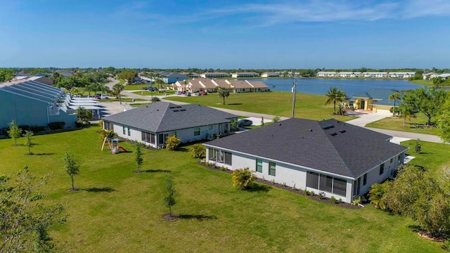 birds eye view of property featuring a water view