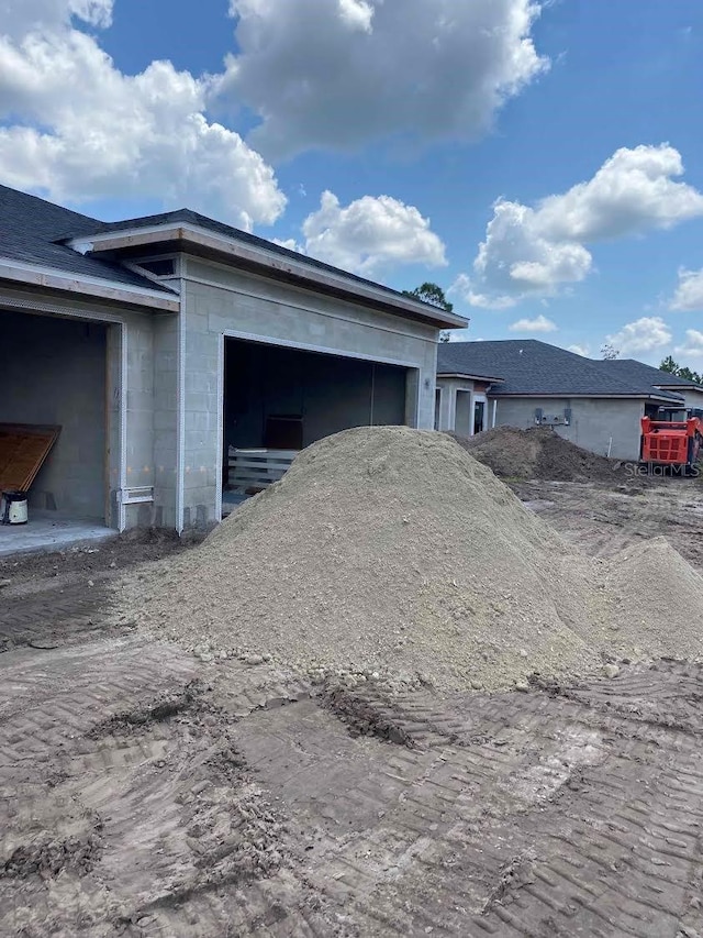 view of side of property with a garage