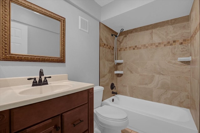 bathroom with visible vents, shower / bathing tub combination, vanity, and toilet