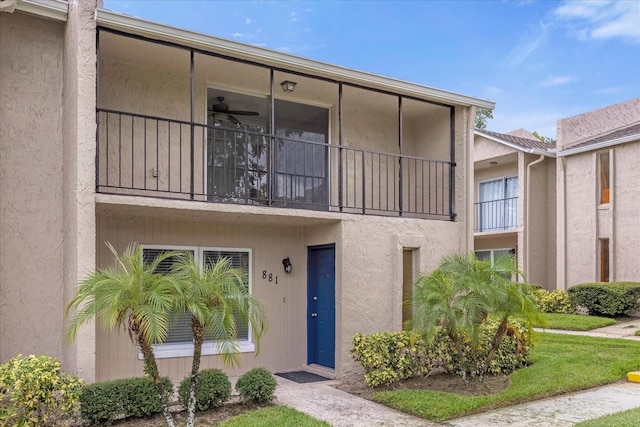 view of front of house with a balcony