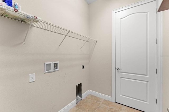 clothes washing area featuring hookup for a washing machine, electric dryer hookup, and light tile patterned floors