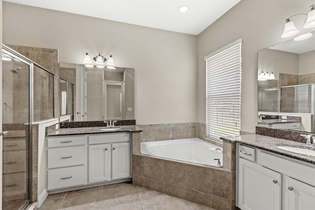 bathroom featuring separate shower and tub, tile patterned flooring, and vanity