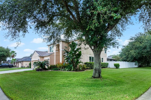 view of side of property featuring a yard