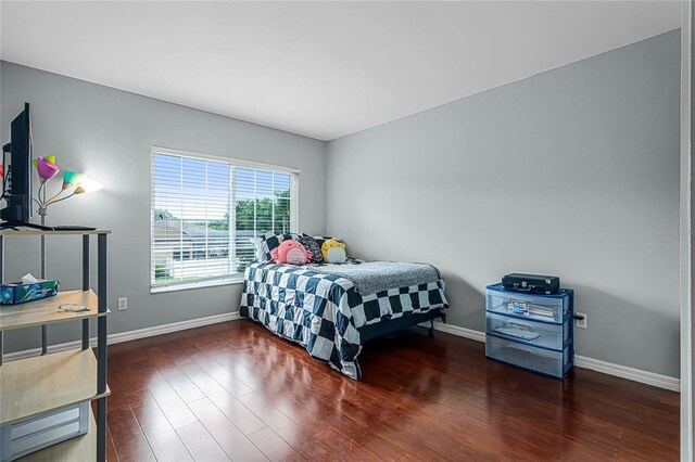 bedroom with wood-type flooring