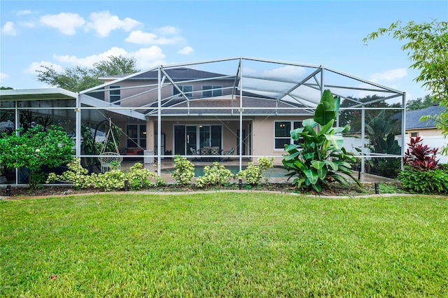 back of property featuring a yard and a lanai