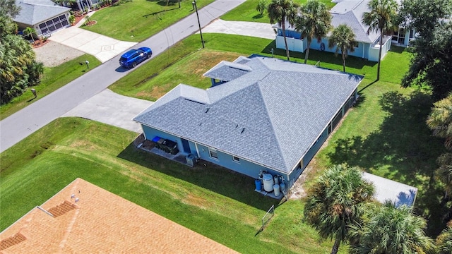 birds eye view of property with a residential view