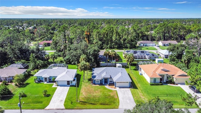 aerial view with a residential view and a view of trees