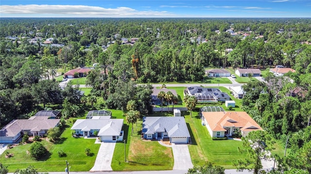 bird's eye view featuring a residential view and a view of trees