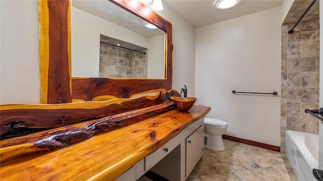 bathroom featuring toilet and vanity