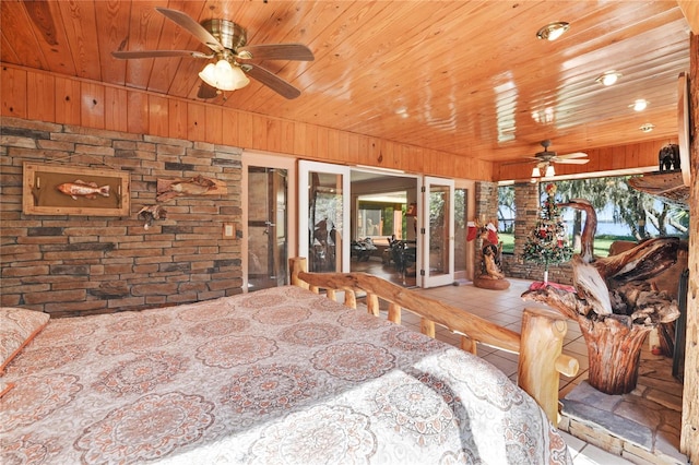 tiled bedroom with wood ceiling and wooden walls